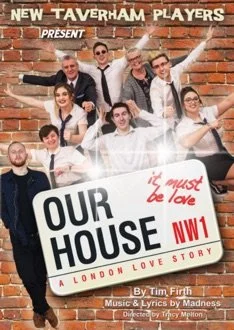 Group of smiling young people in fancy attire posing behind a large 'Our House' musical poster, with a brick wall background, for the Taverham Players production.