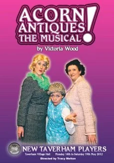 Poster for the musical 'Acorn Antiques' by Victoria Wood, featuring three women in colorful costumes against a purple background.