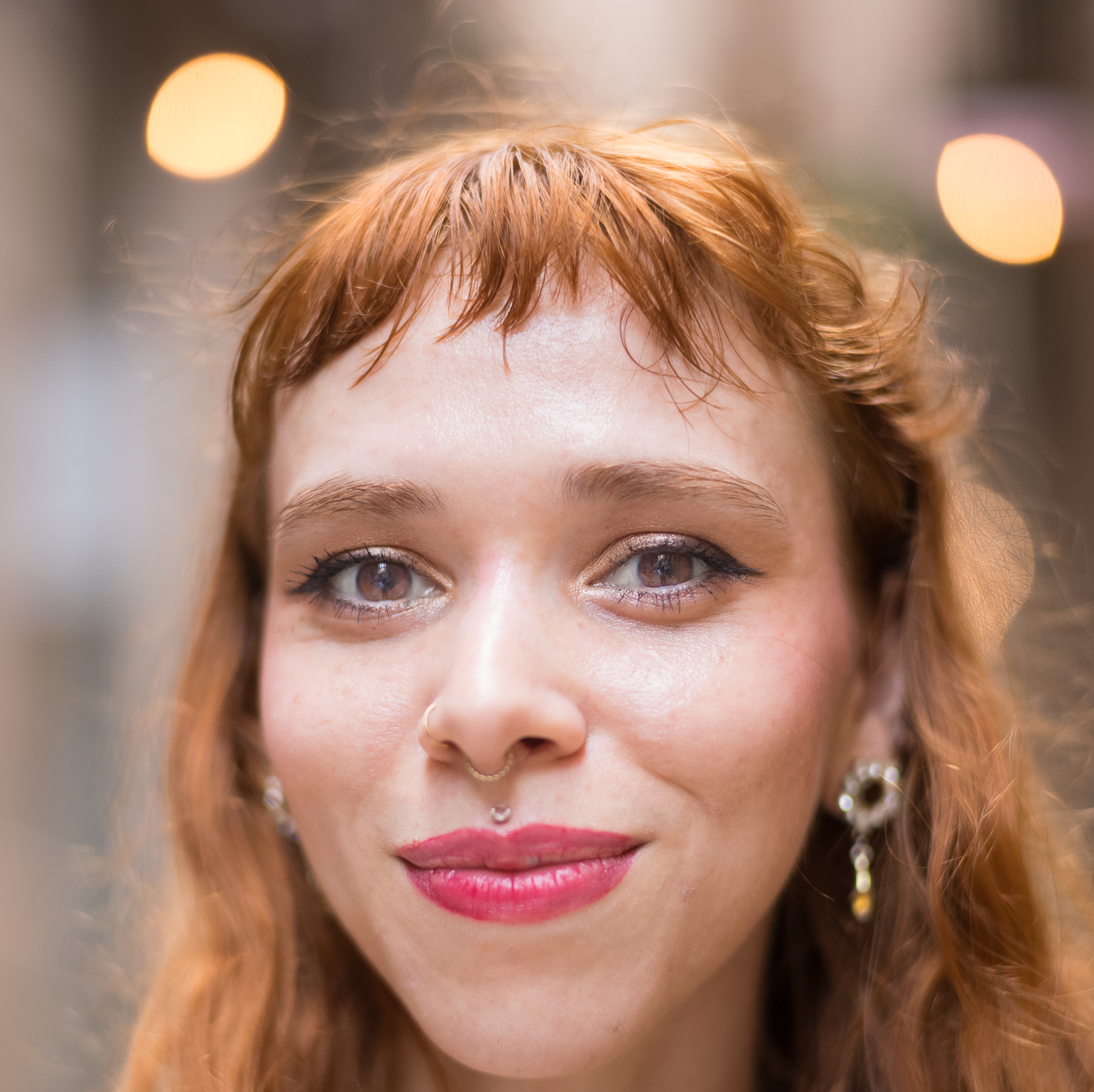 Portrait of a woman with sparkling eyes and ginger hair