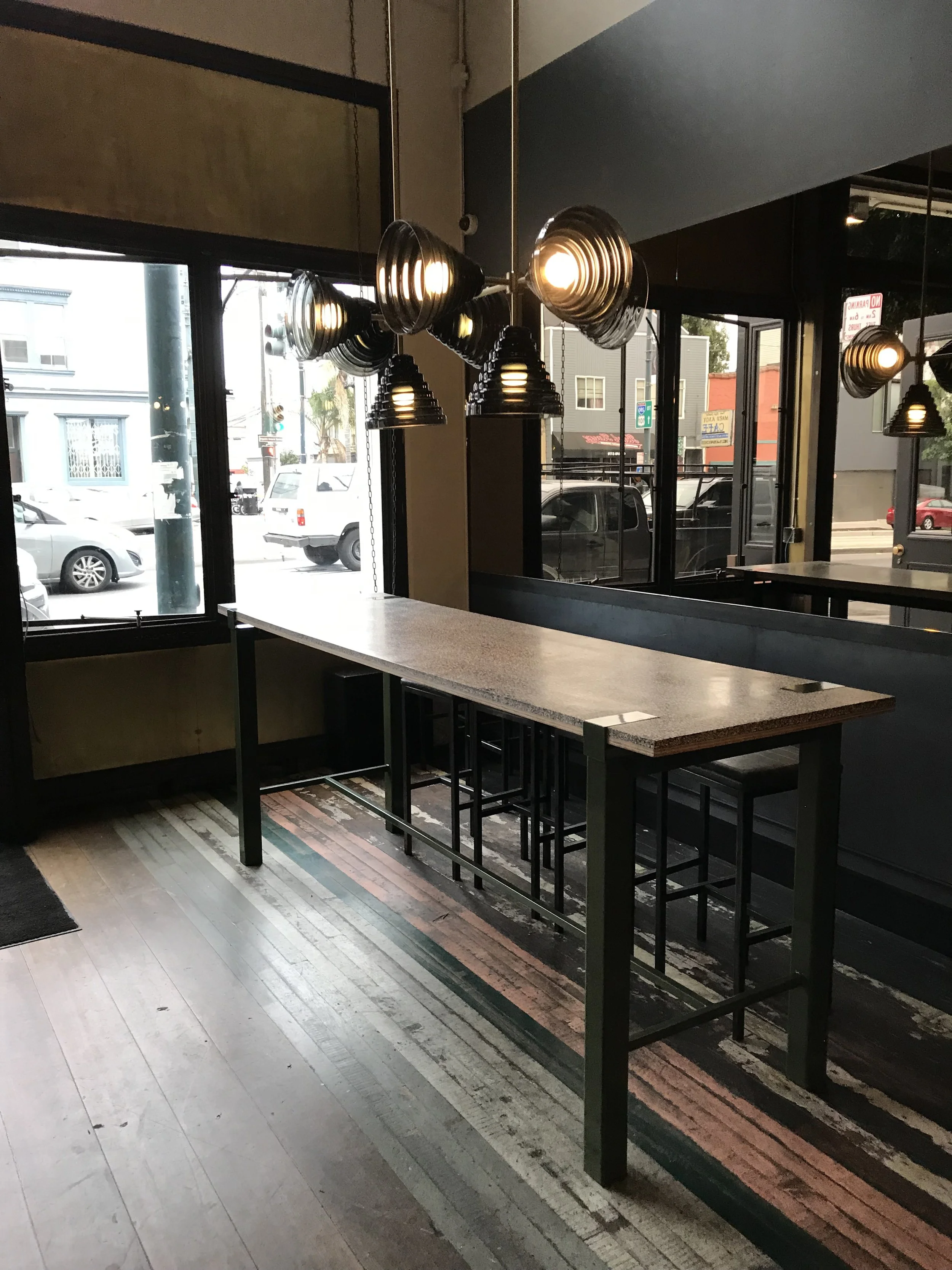 A long narrow table in the entrance of the restaurant.