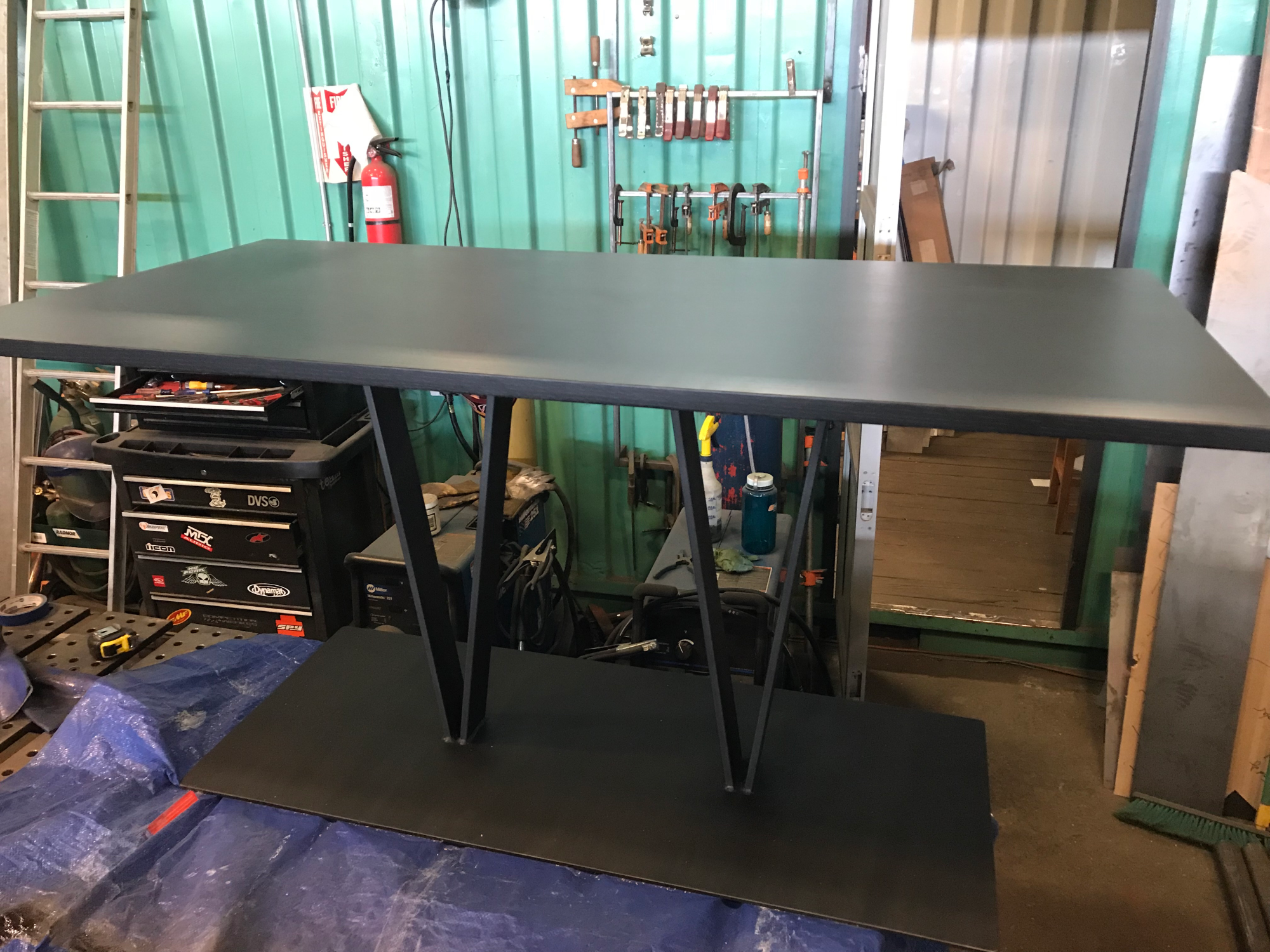Custom made dining table in the workshop being finalised.