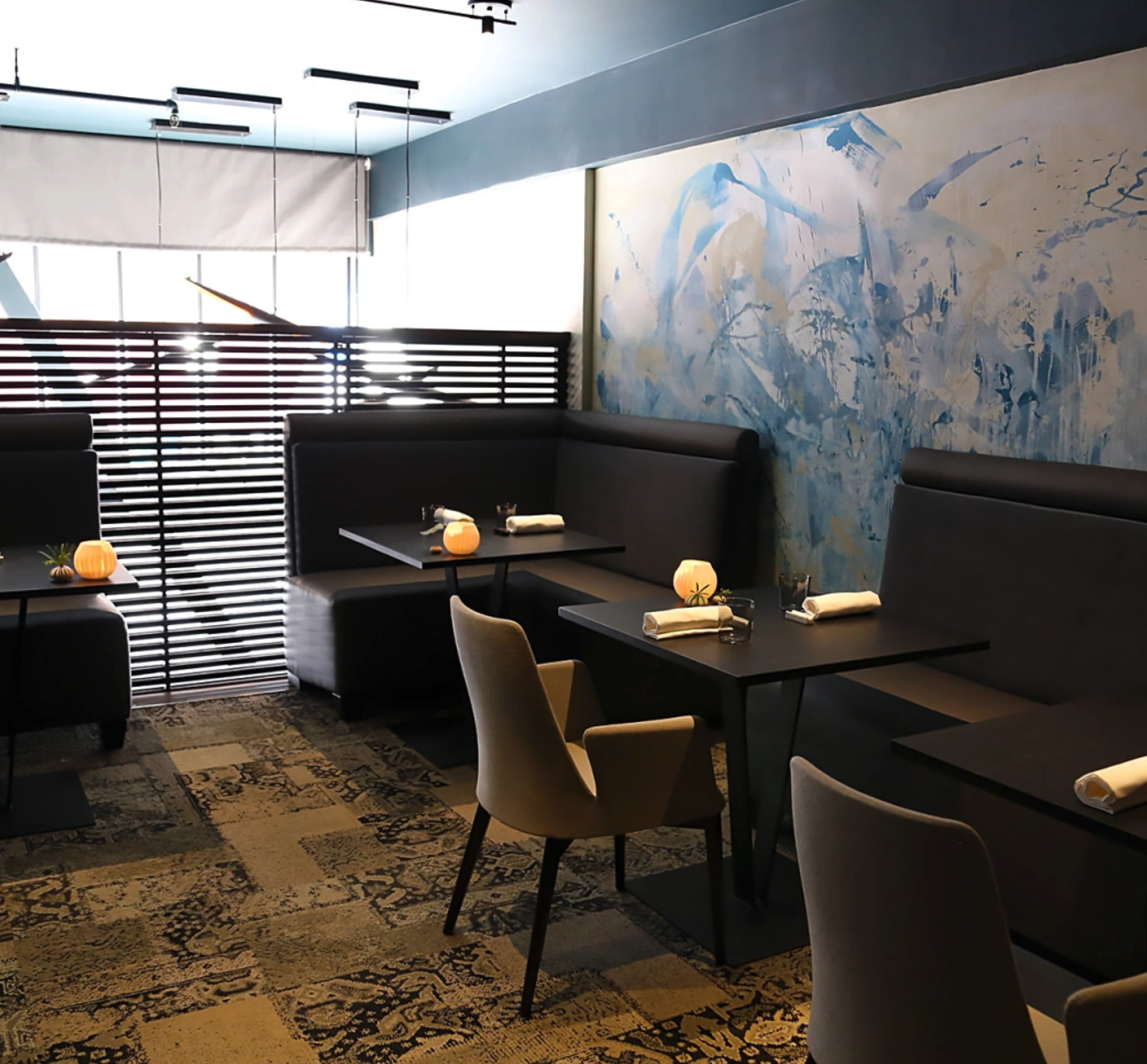 Custom made dining tables set up and ready for guests.