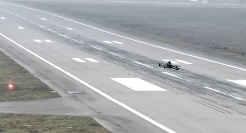 Drone performing airport runway inspection work.