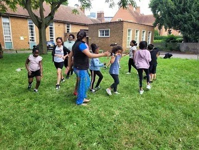 Outdoor physical activities supporting teamwork and collaboration with participants.
