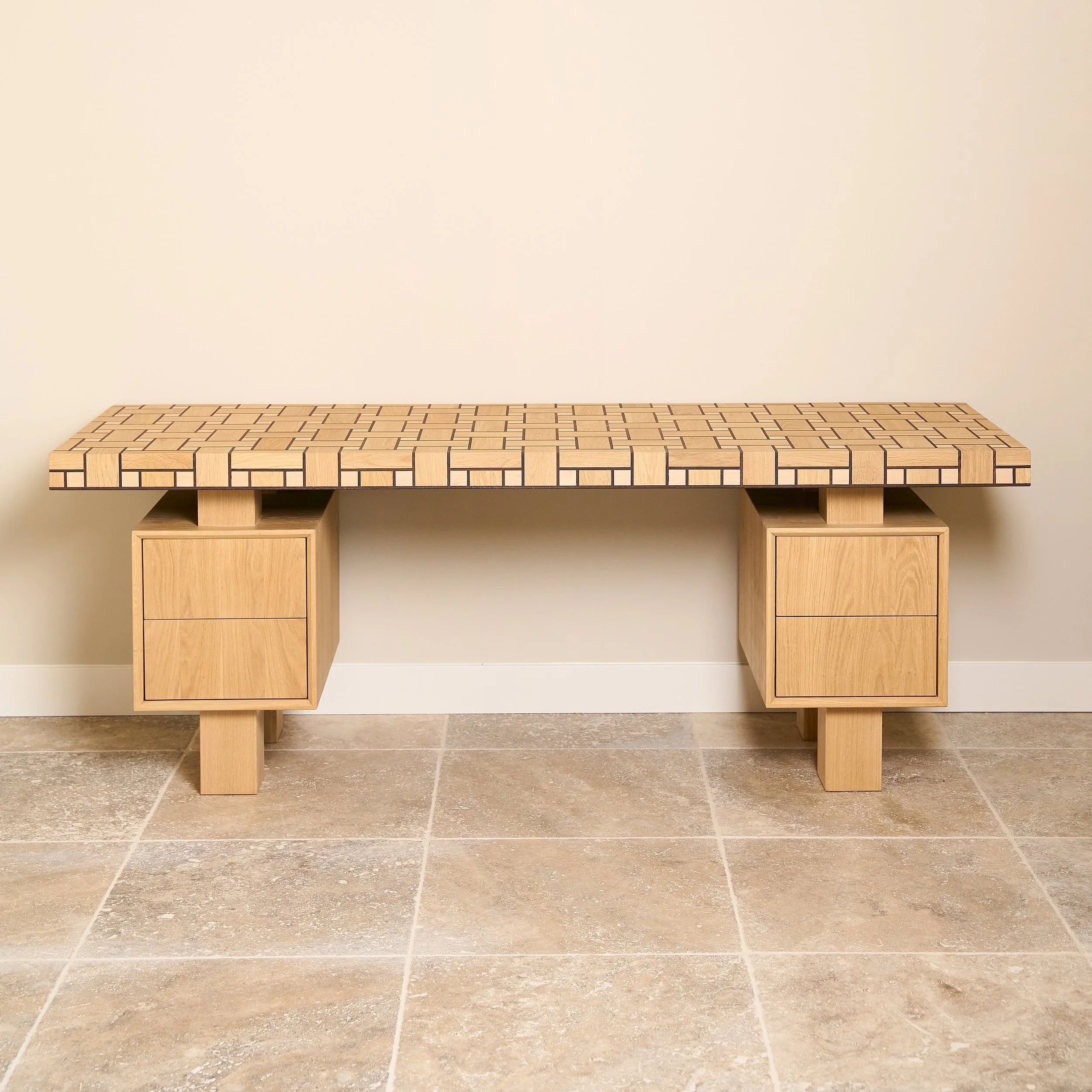 Wooden bench with a patterned top, two storage compartments underneath, against a beige wall and tiled floor.