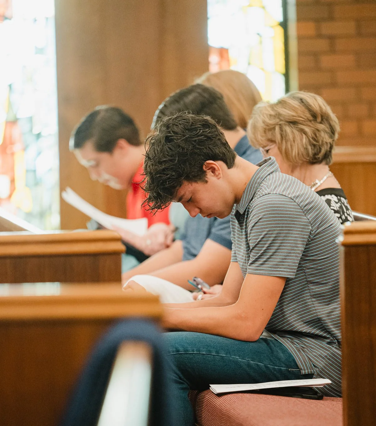 People sitting in pews inside a church