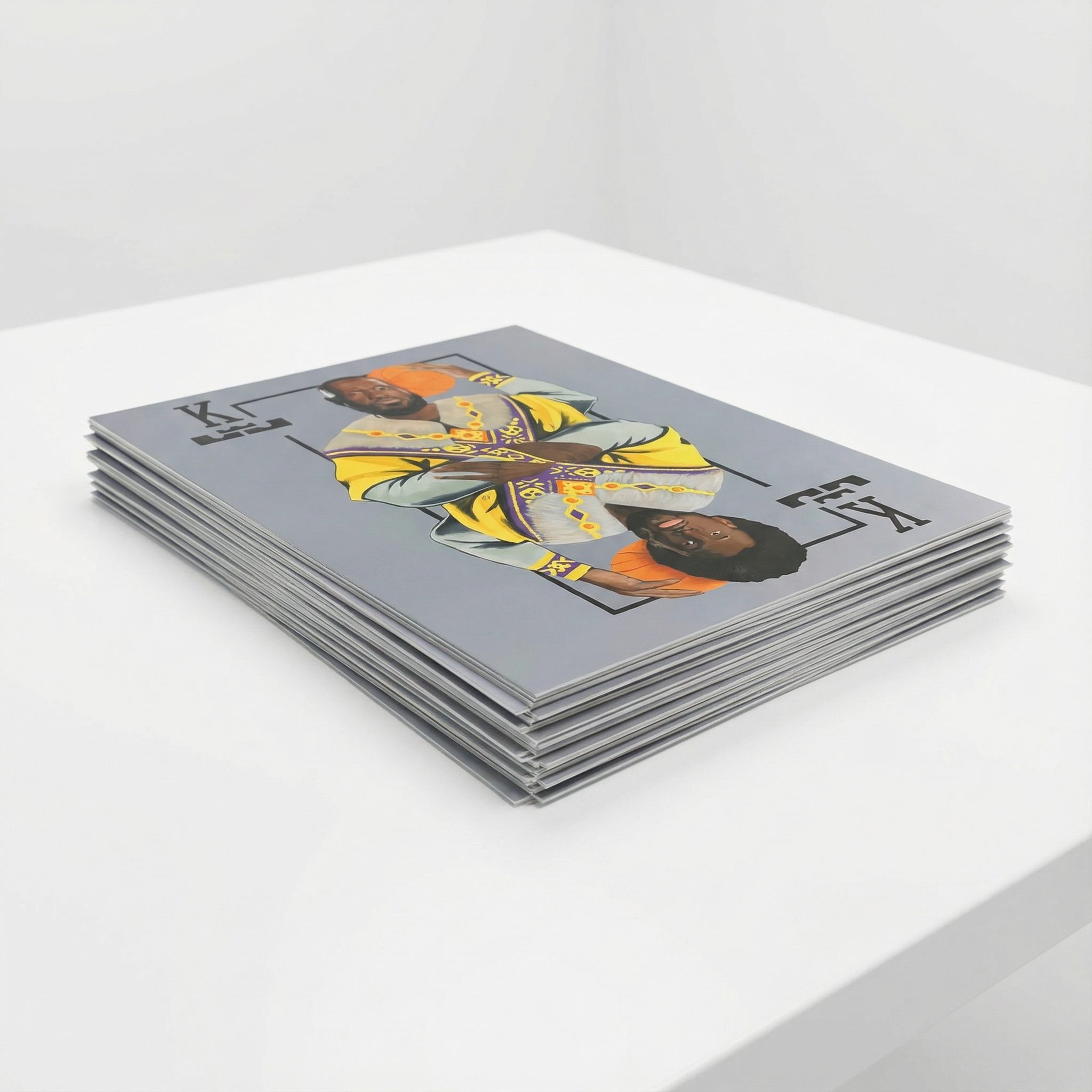 Generated with Kive.ai - as a stack of posters laying on a clean white table in an all white room.png