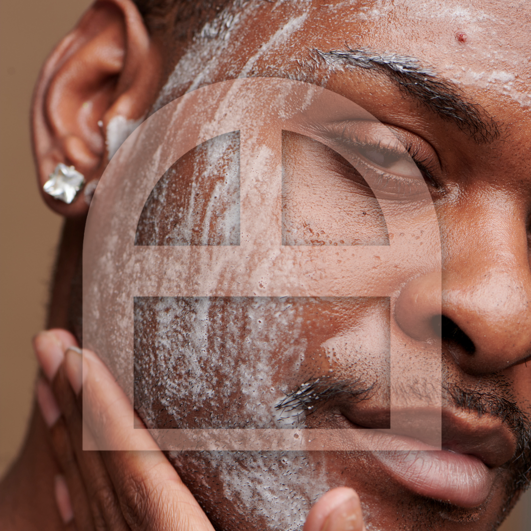 Close-up of a man with shaved face applying skincare product, with a large透明 circle containing a geometric pattern overlayed on the image.