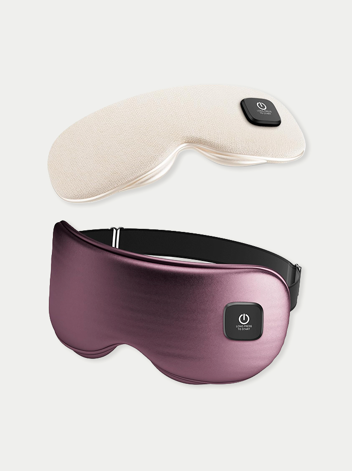 Two sleep masks, one beige with a small black power button and one purple with a large power button, against a white background.