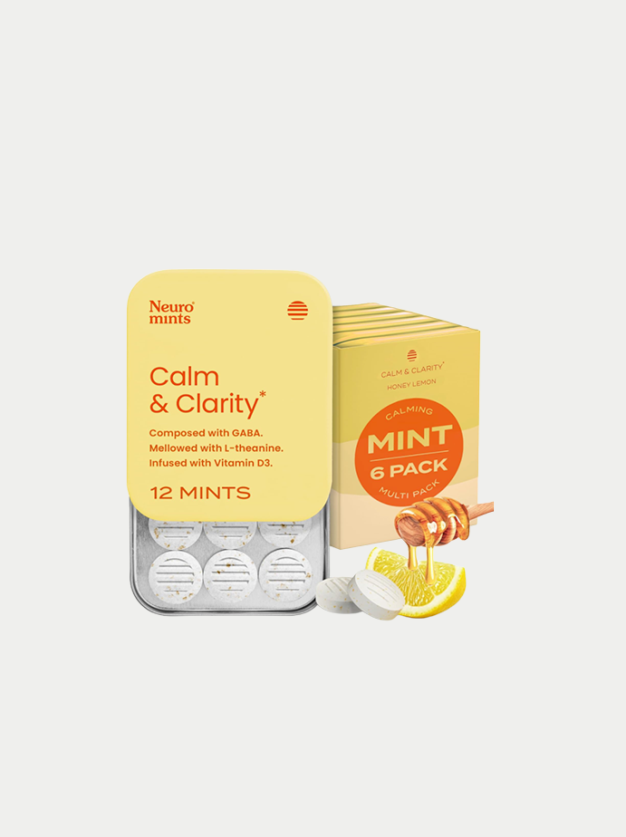 Box of Neuro Mints Calm & Clarity, honey lemon flavor, 12 mints inside, with a pack of 6 mints flavor inside a box, lemon slices, and honey dipper with honey