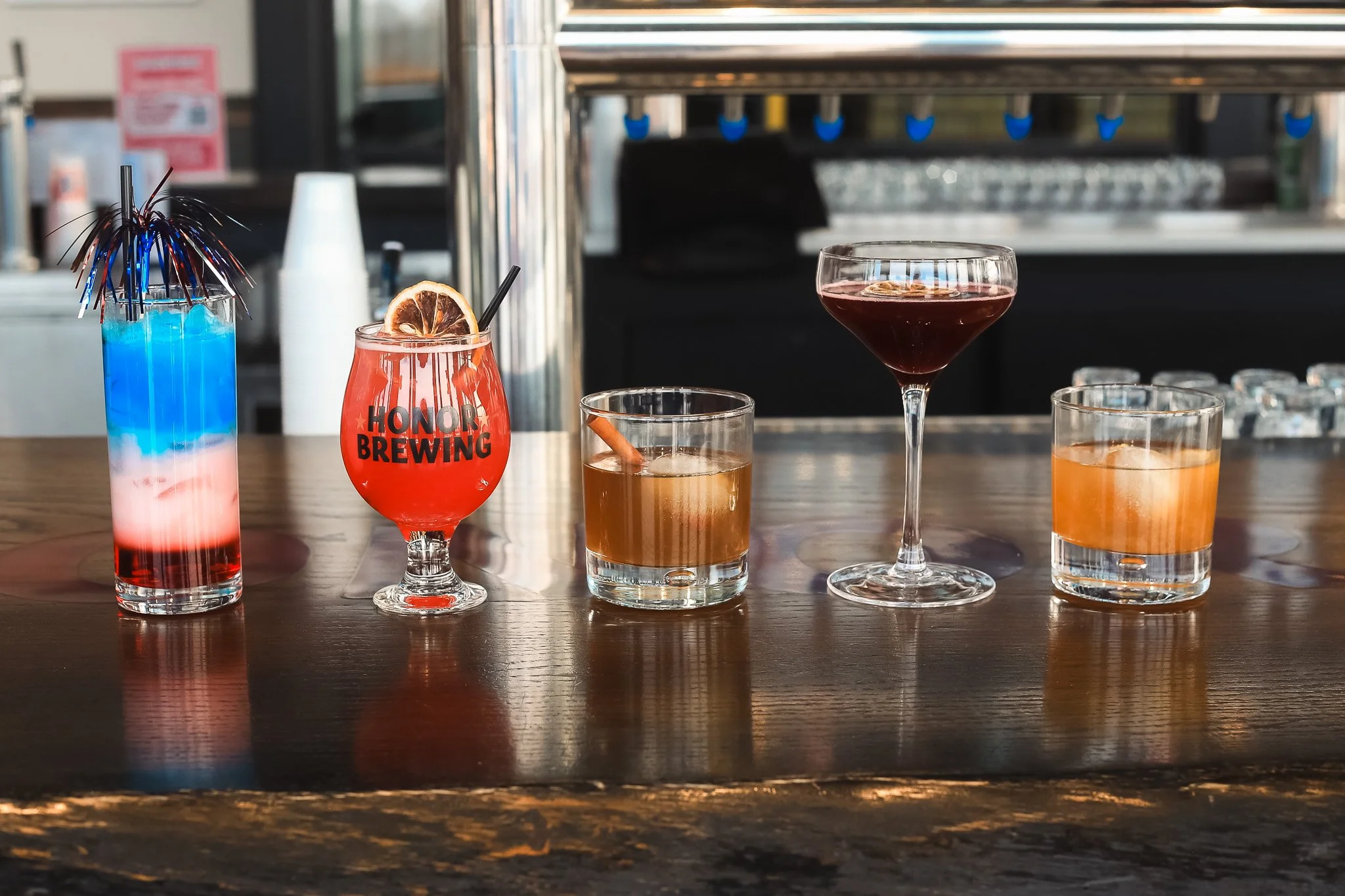 Step up to the bar and raise a glass to bold flavors and victory-worthy sips. From smoky classics to refreshing finishes, our cocktail lineup is ready for your next celebration.

🥇 For the Gold &mdash; Heritage Whiskey, lemon juice, and honey chai s