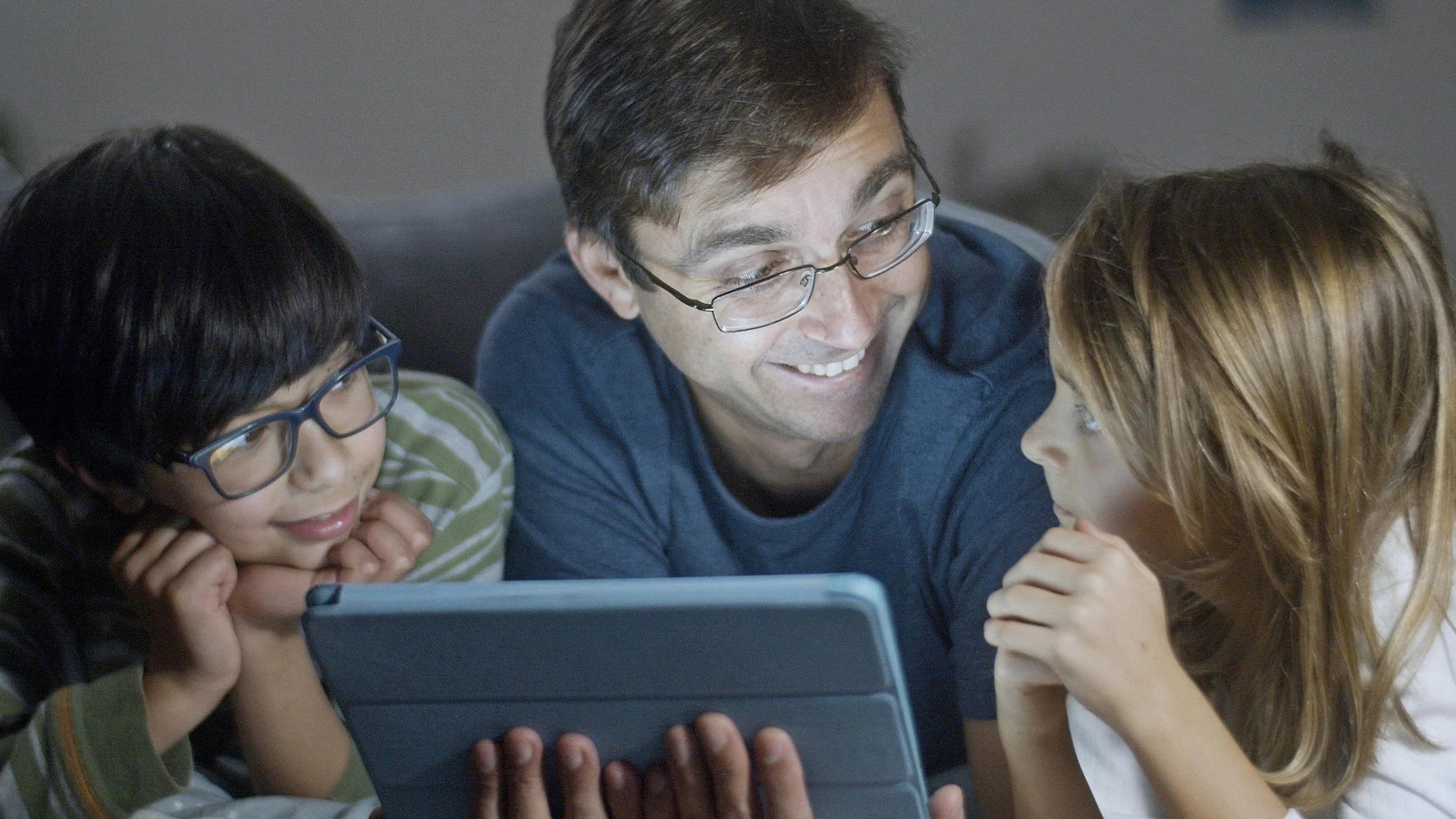 Parents receiving feedback on tutoring sessions.