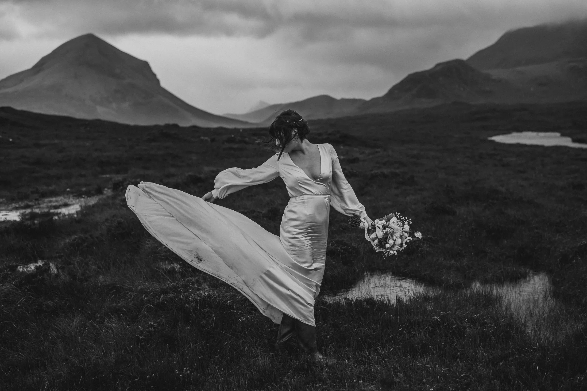 Dramatic black and white portrait of bride amongst the Scottish wilderness during elopement