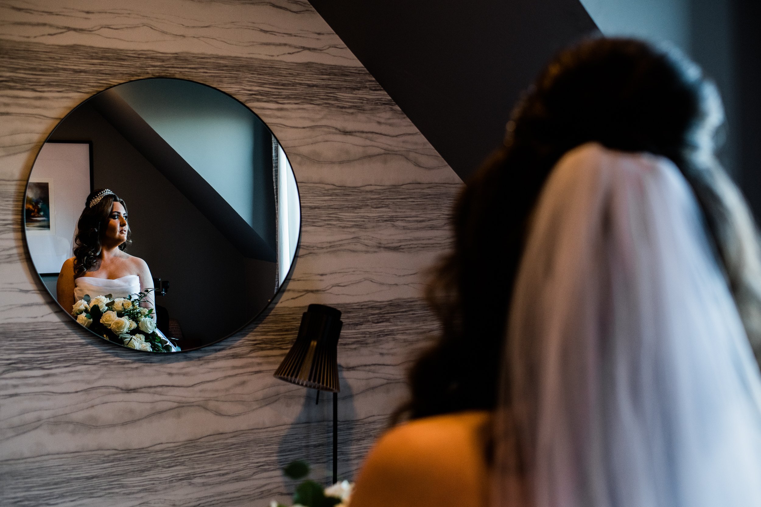 Bride looking into mirror Cameron House