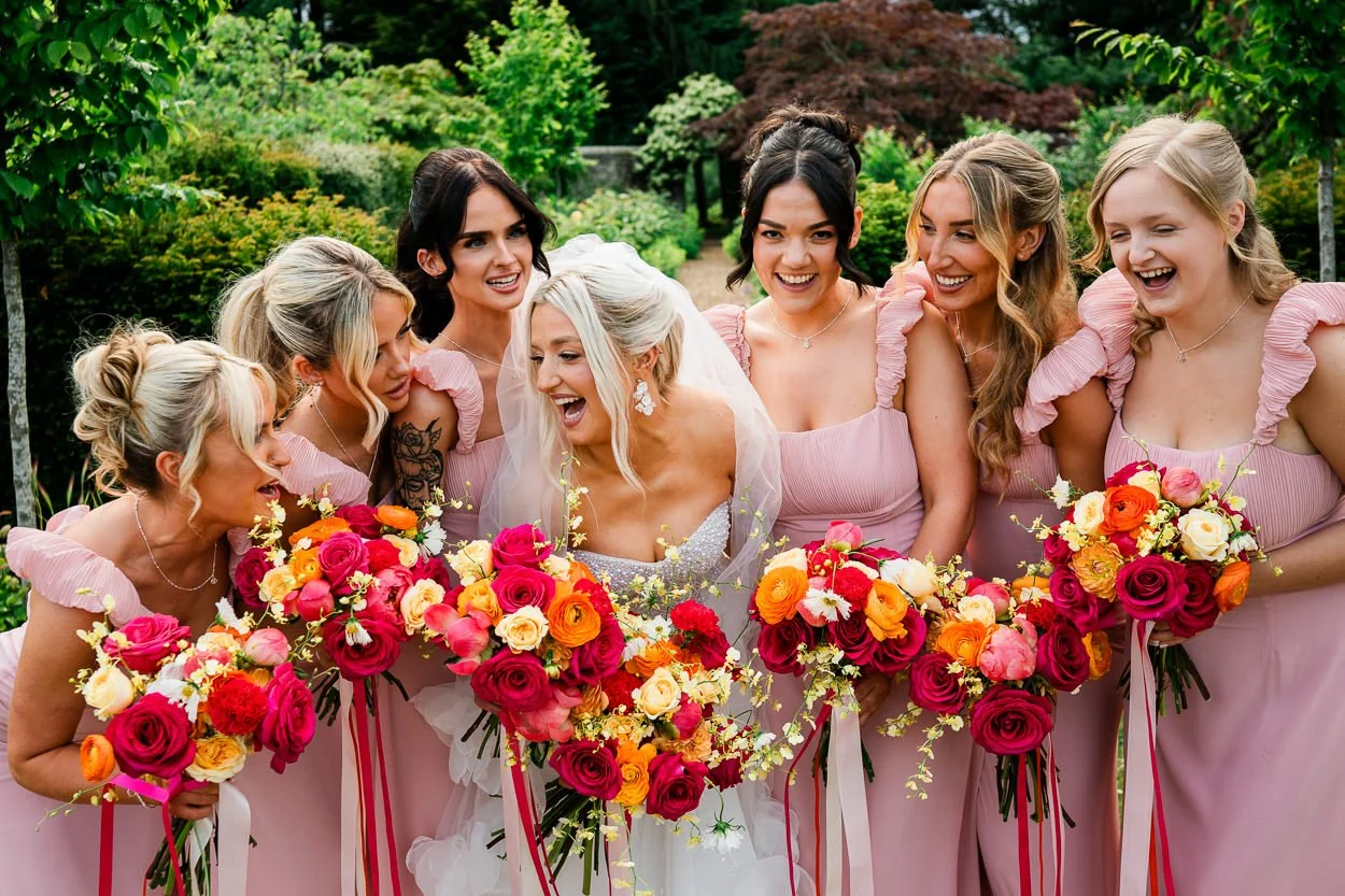Big-laughter-from-bride-and-bridemaids-Pink-colourful-bridemaids-dresses