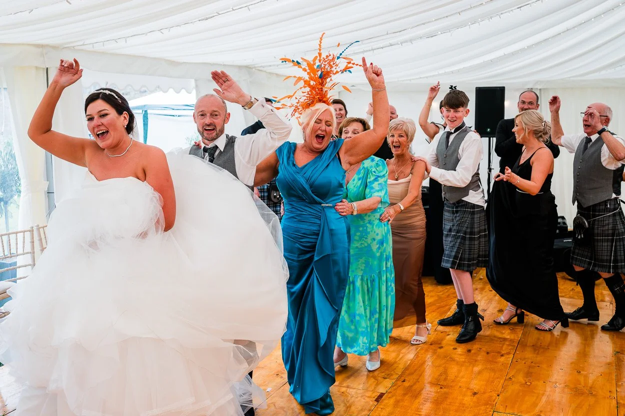 Conga-line-on-dance-floor-at-Aberdeenshire-wedding