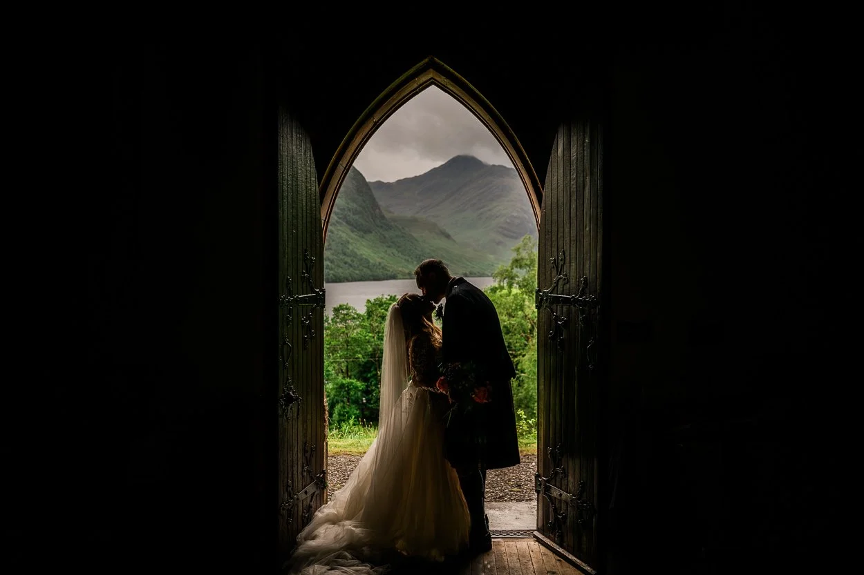 Bride and groom silhouette picture in the doorway of a church