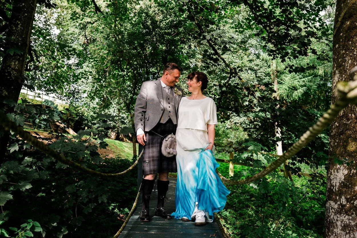Bride and groom portrait amongst the trees