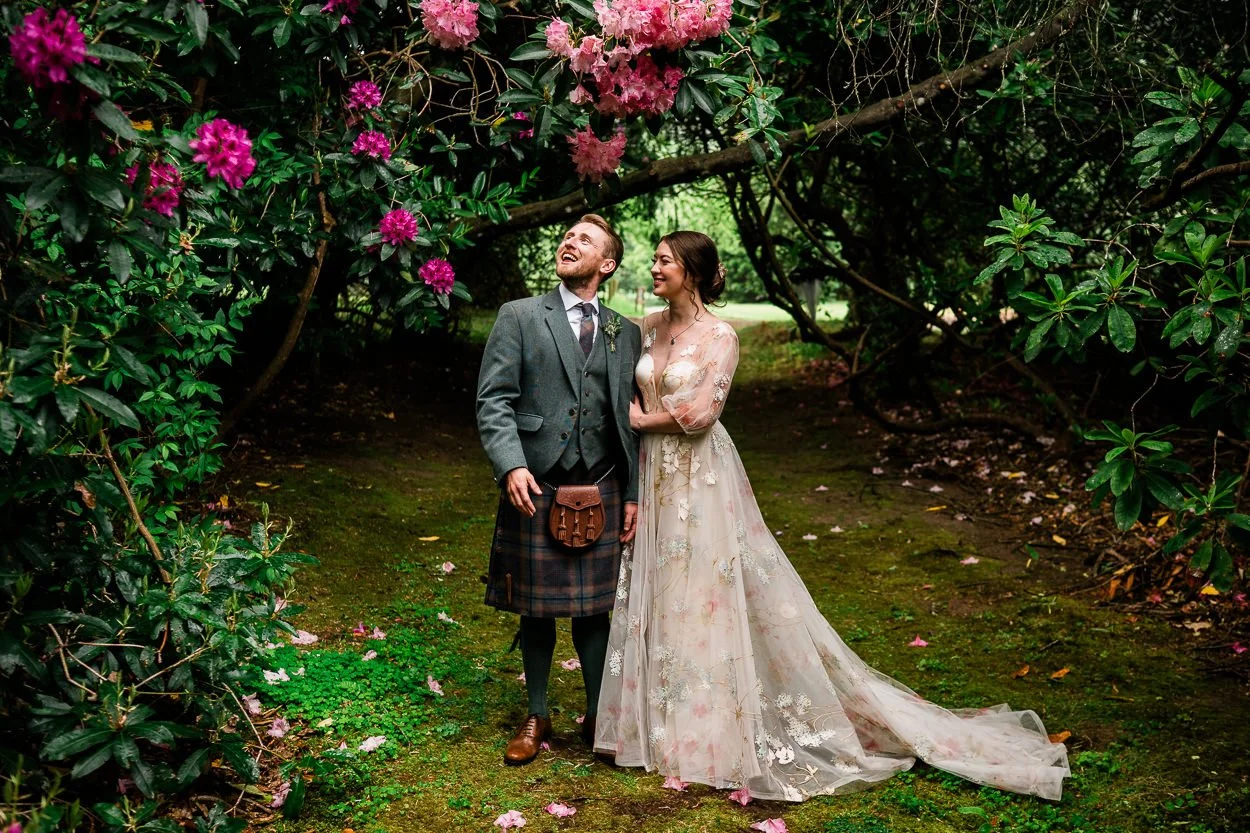 Bride-and-groom-amongst-flowers-at-Byre-at-inchyra