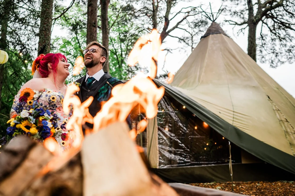 Bride-and-groom-being-photographed-through-fire