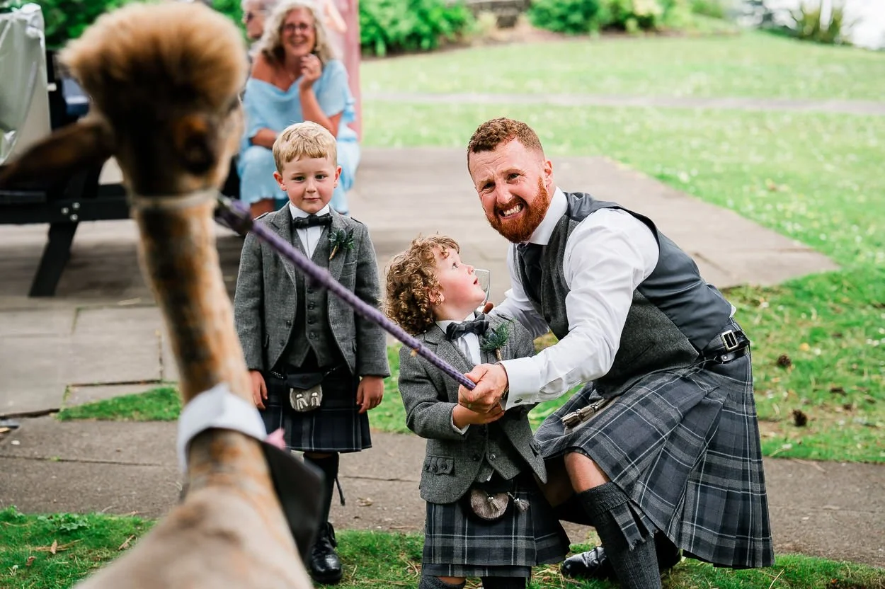 Groom-and-page-boys-pulling-a-llama
