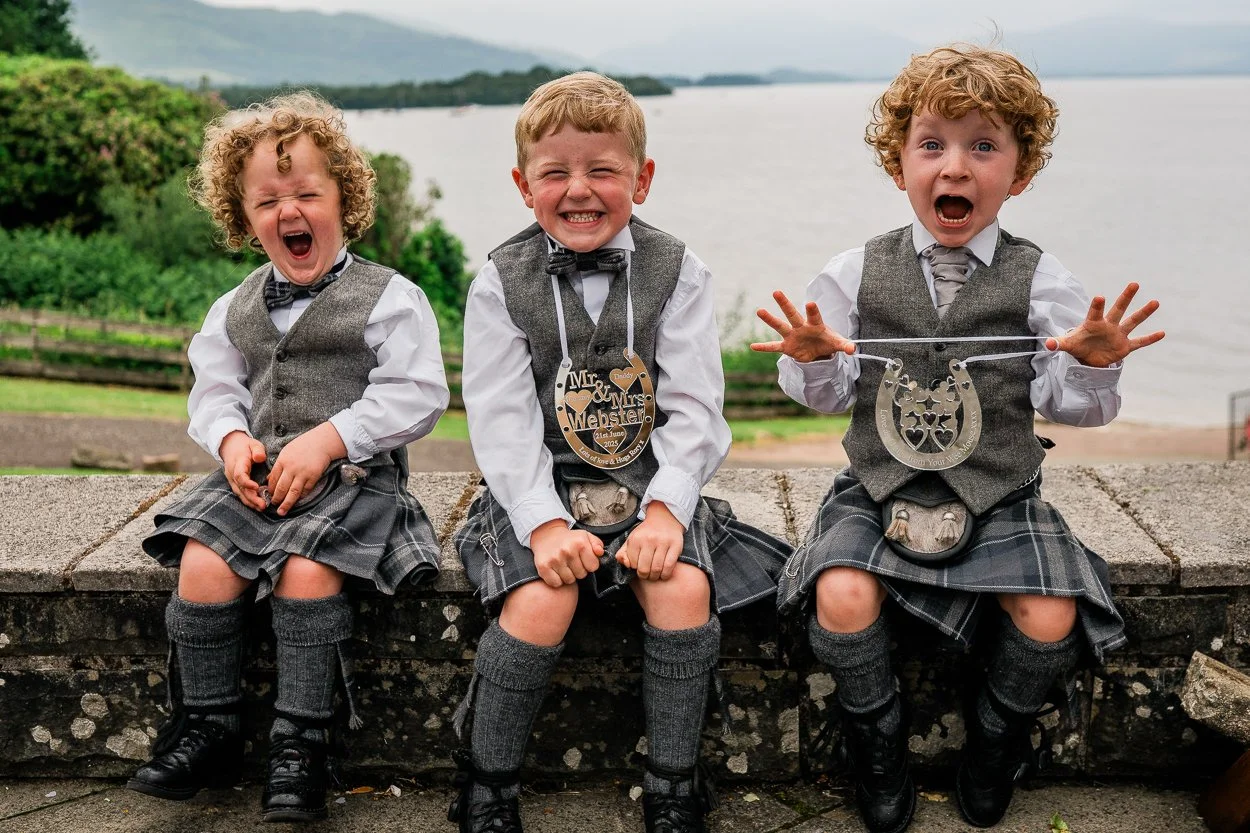 Three-little-boys-pulling-silly-faces-at-wedding