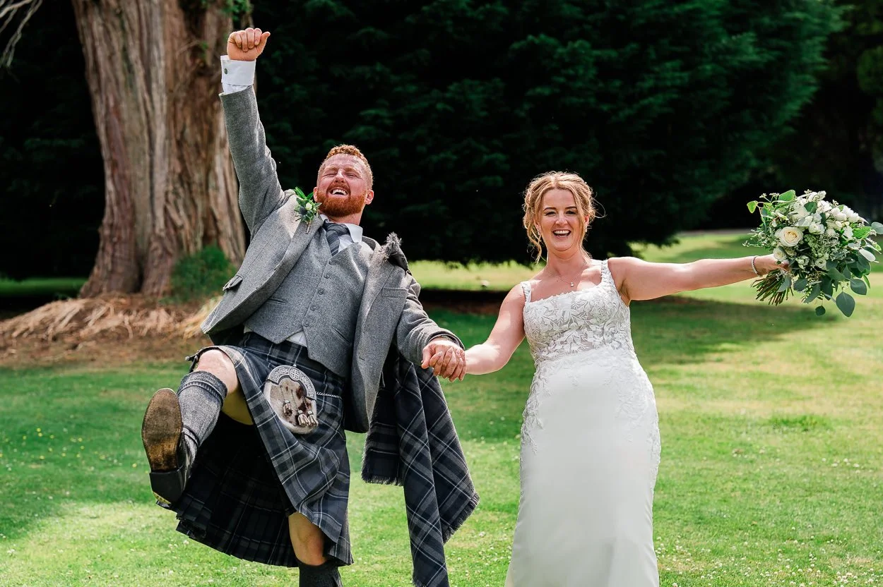 Bride and groom doing a funny walk