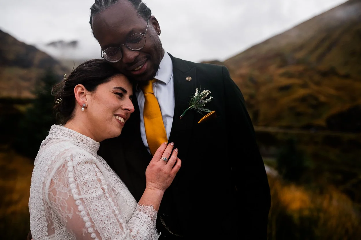 Bride and groom hugging and laughing on Scottish elopement