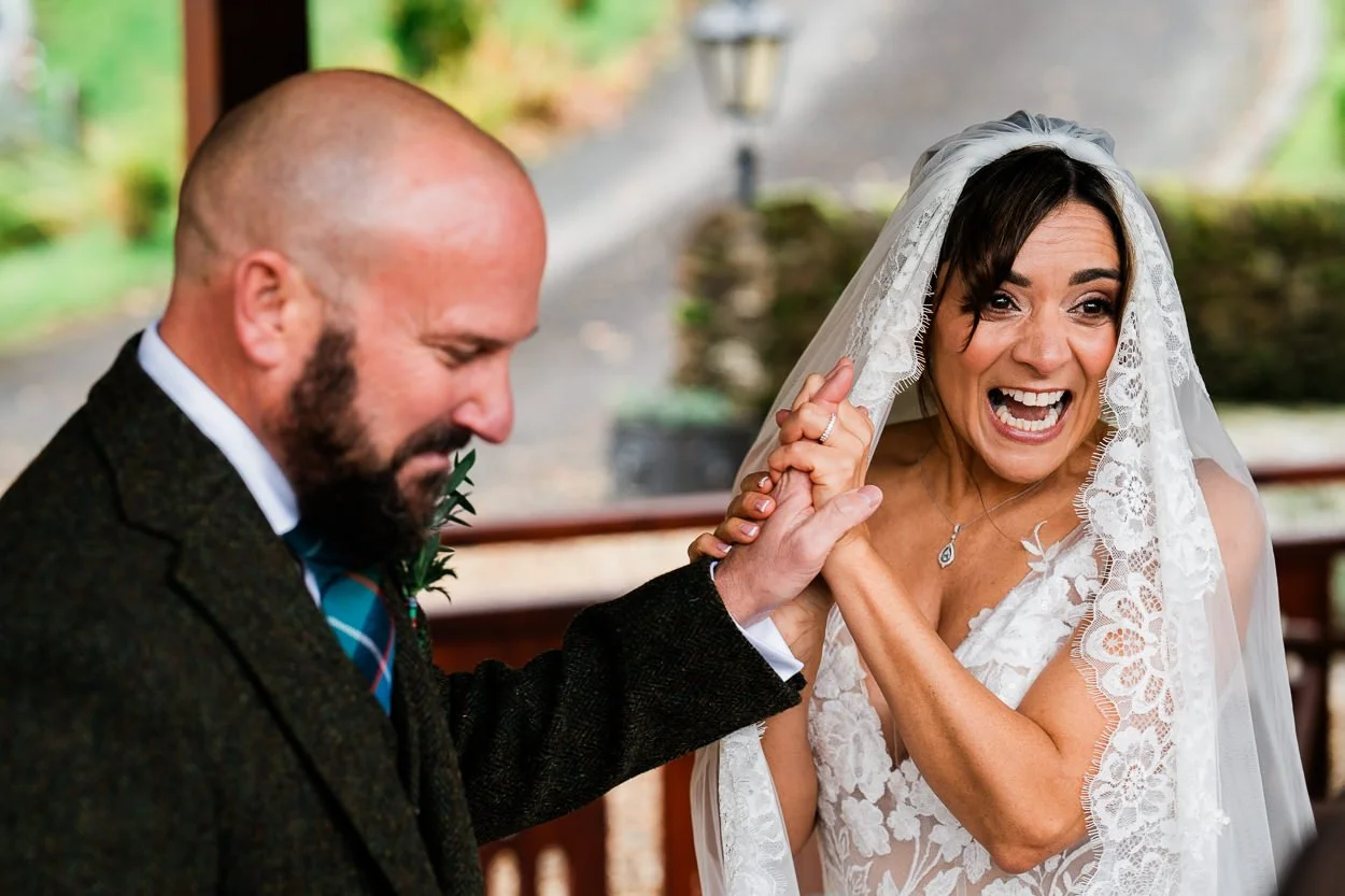 Bride screaming with joy at wedding ceremony