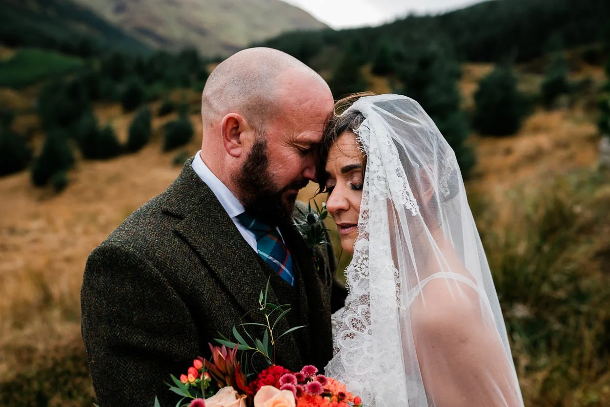 Emotional picture of connection between bride and groom on elopement