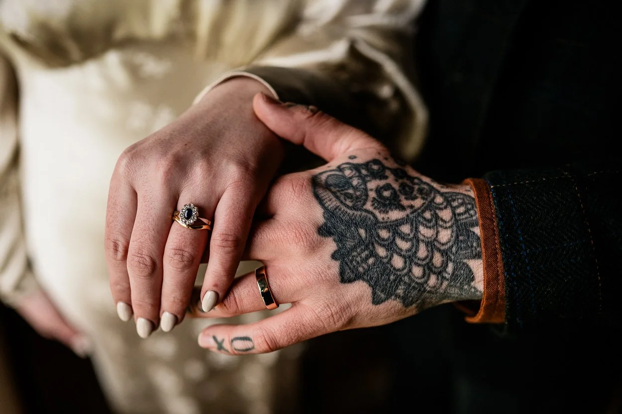 Bride-and-grooms-tattooed-hands