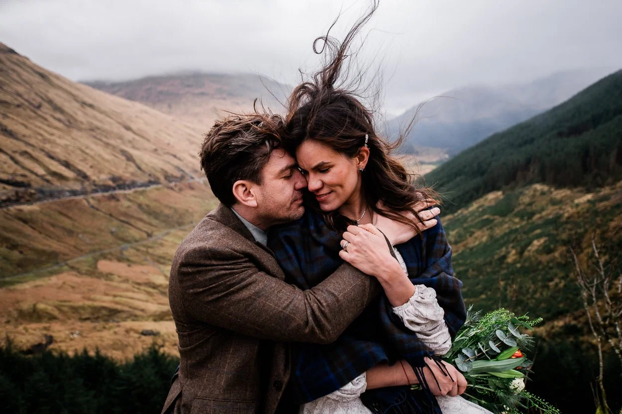 Windswept-bride-and-groom-up-Scottish-mountain