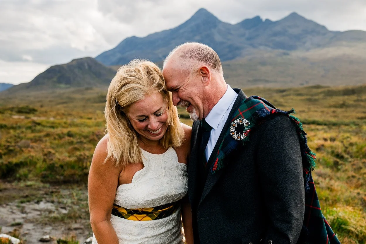 Bride and groom laughing hard during wedding on Isle of Skye