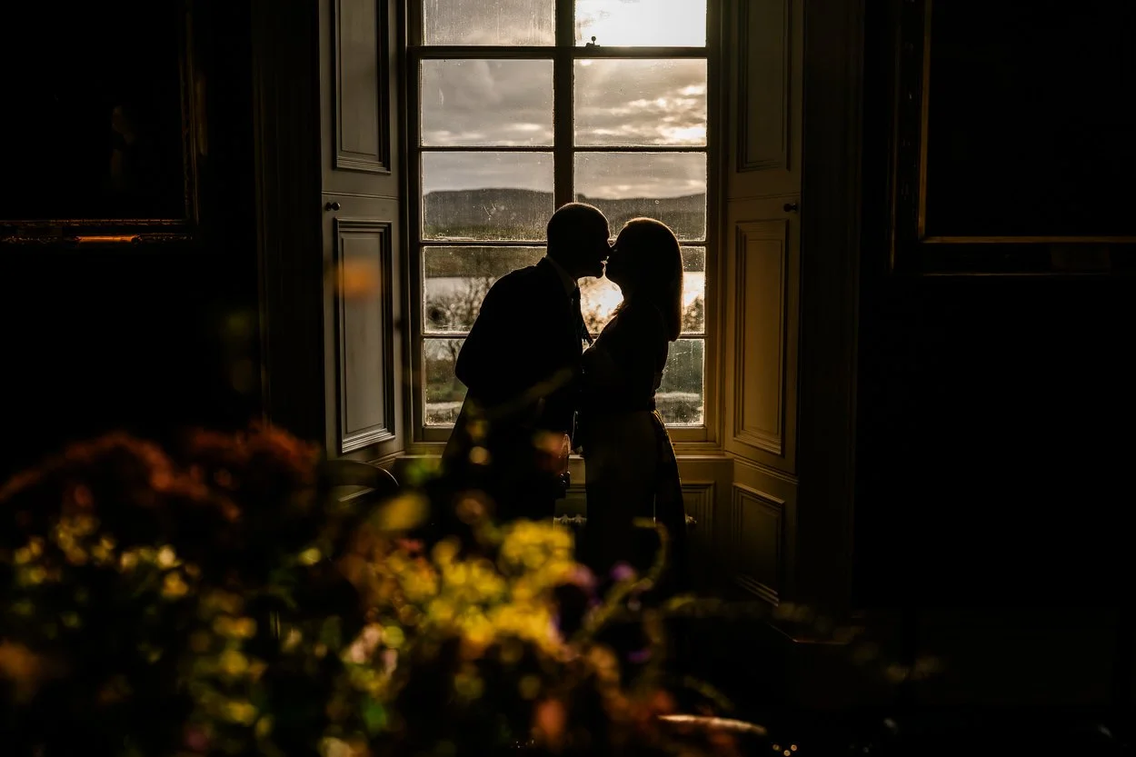 Bride-and-groom-portrait-in-window-at-Dunvegan-Castle