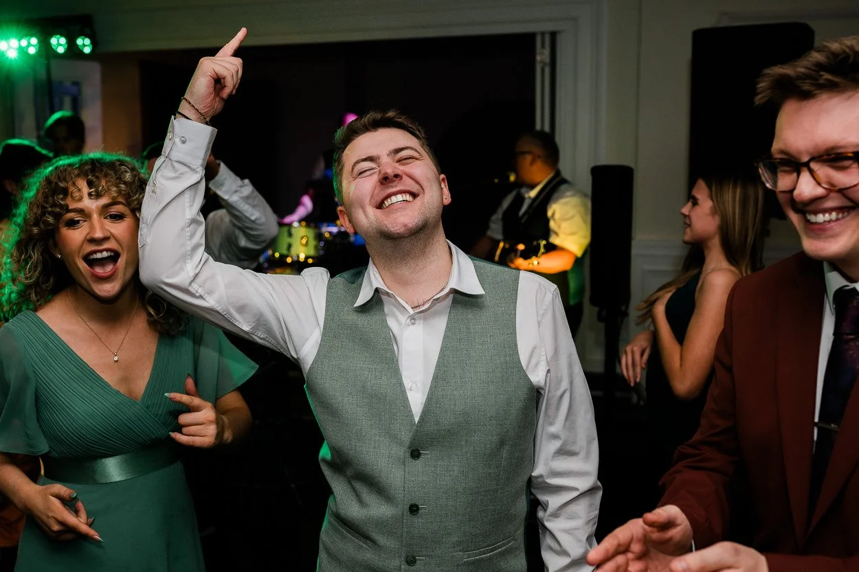 Guest dancing with lots of energy at a wedding