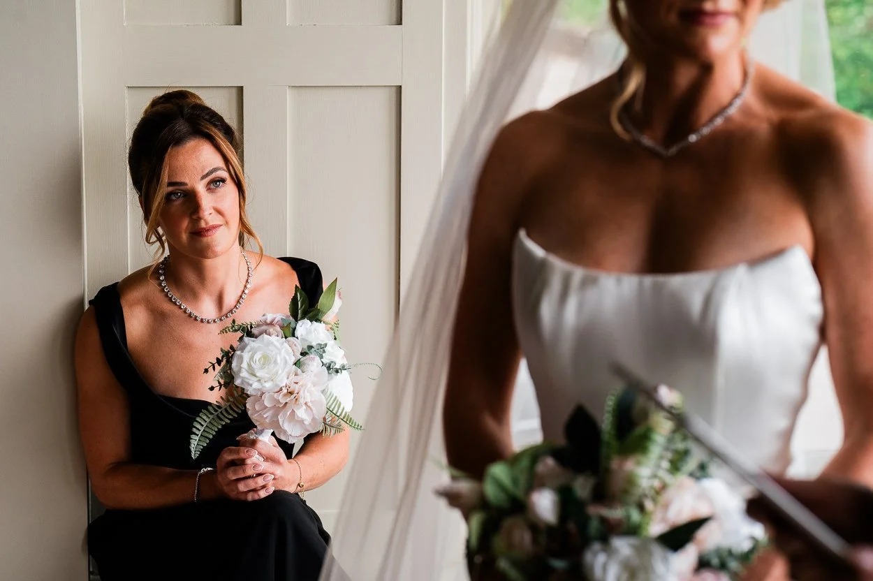 Bridesmaid-looking-on-emotionally-during-ceremony