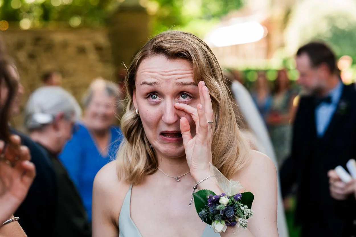 Bridesmaid-crying-at-sisters-wedding