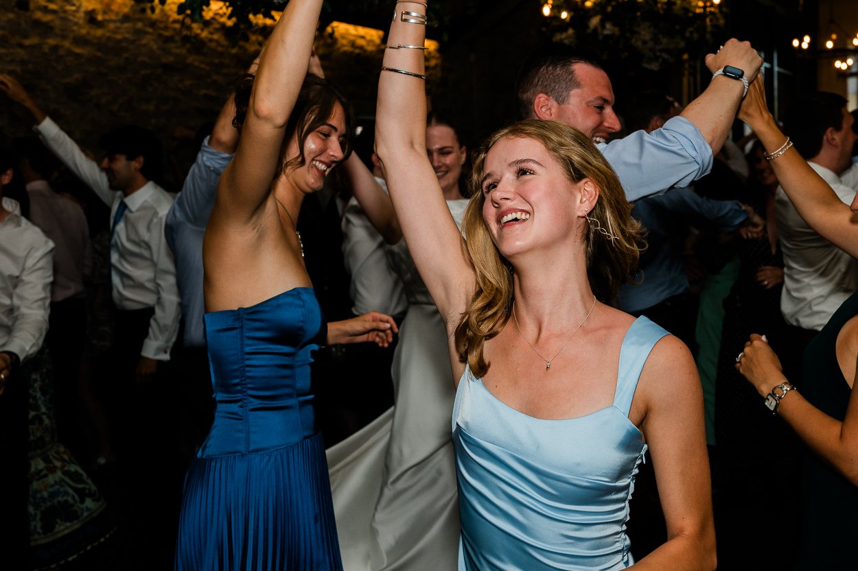 Bridemaids doing ceilidh dancing at Scottish wedding