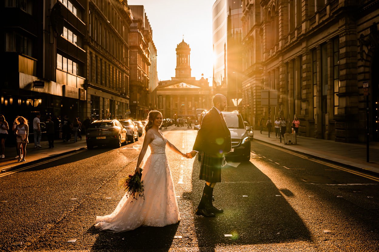 Bride and groom in silhouette golden hour at GOMA Glasgow