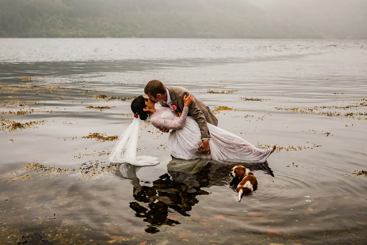 Bride-and-groom-in-water-whilst-still-in-wedding-clothes