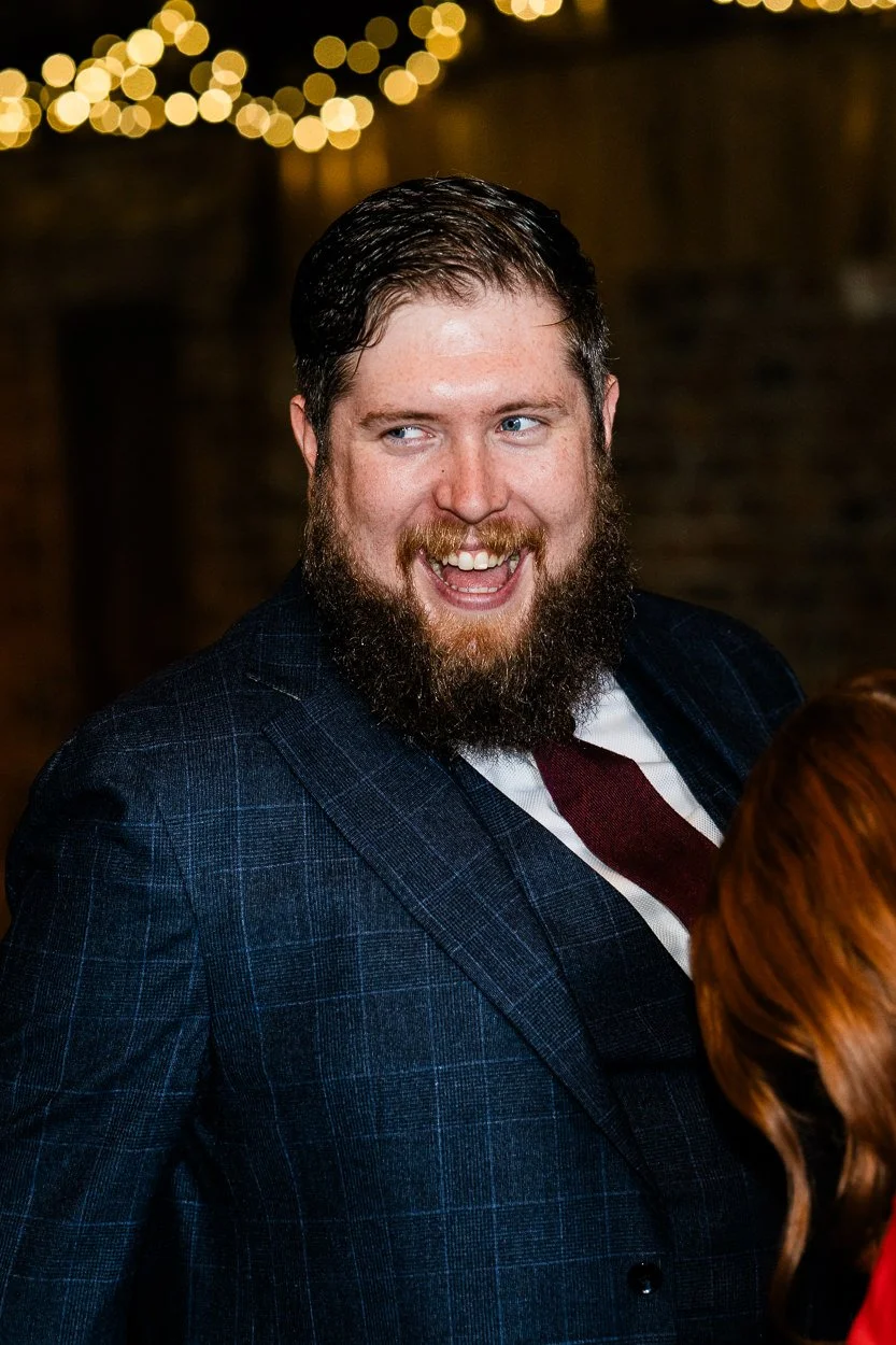 Guest laughing during drinks reception
