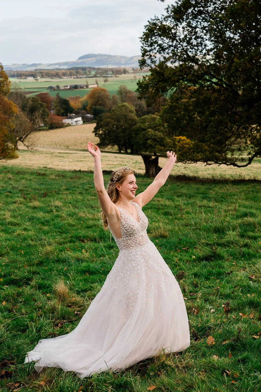 Bride dancing on top of hill at Byre at Inchyra