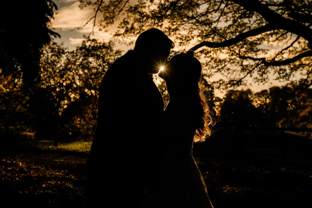 Bride and groom in autumn woodland