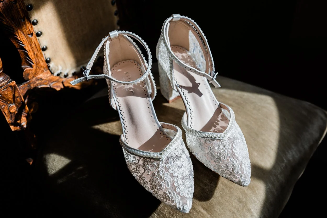 Brides shoes in window light
