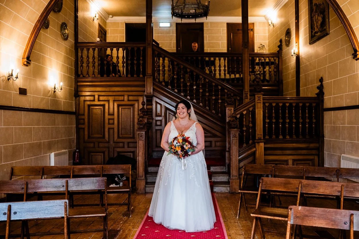 Bride walking down the aisle at Dalhousie Castle chapel