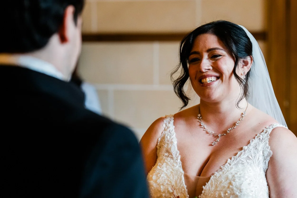 Bride laughing during wedding ceremony