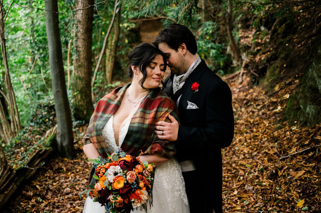 Autumnal woodland portrait bride and groom