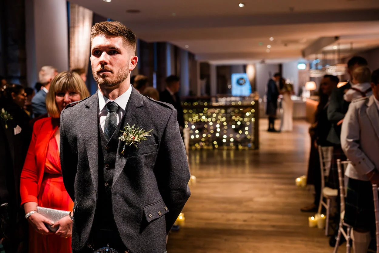 Groom waiting nervously at alter at citation wedding