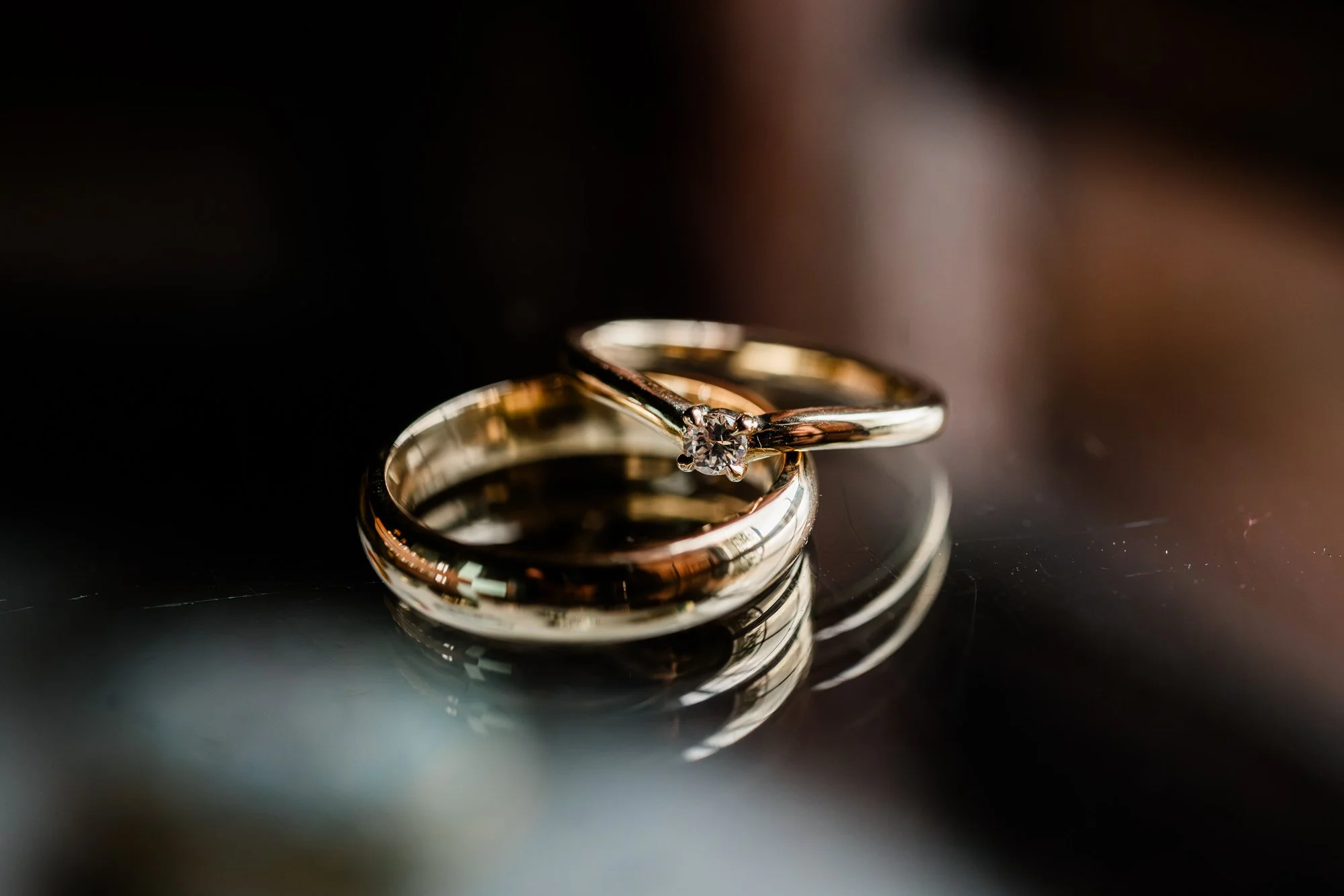 Close-up of the wedding rings stacked together.