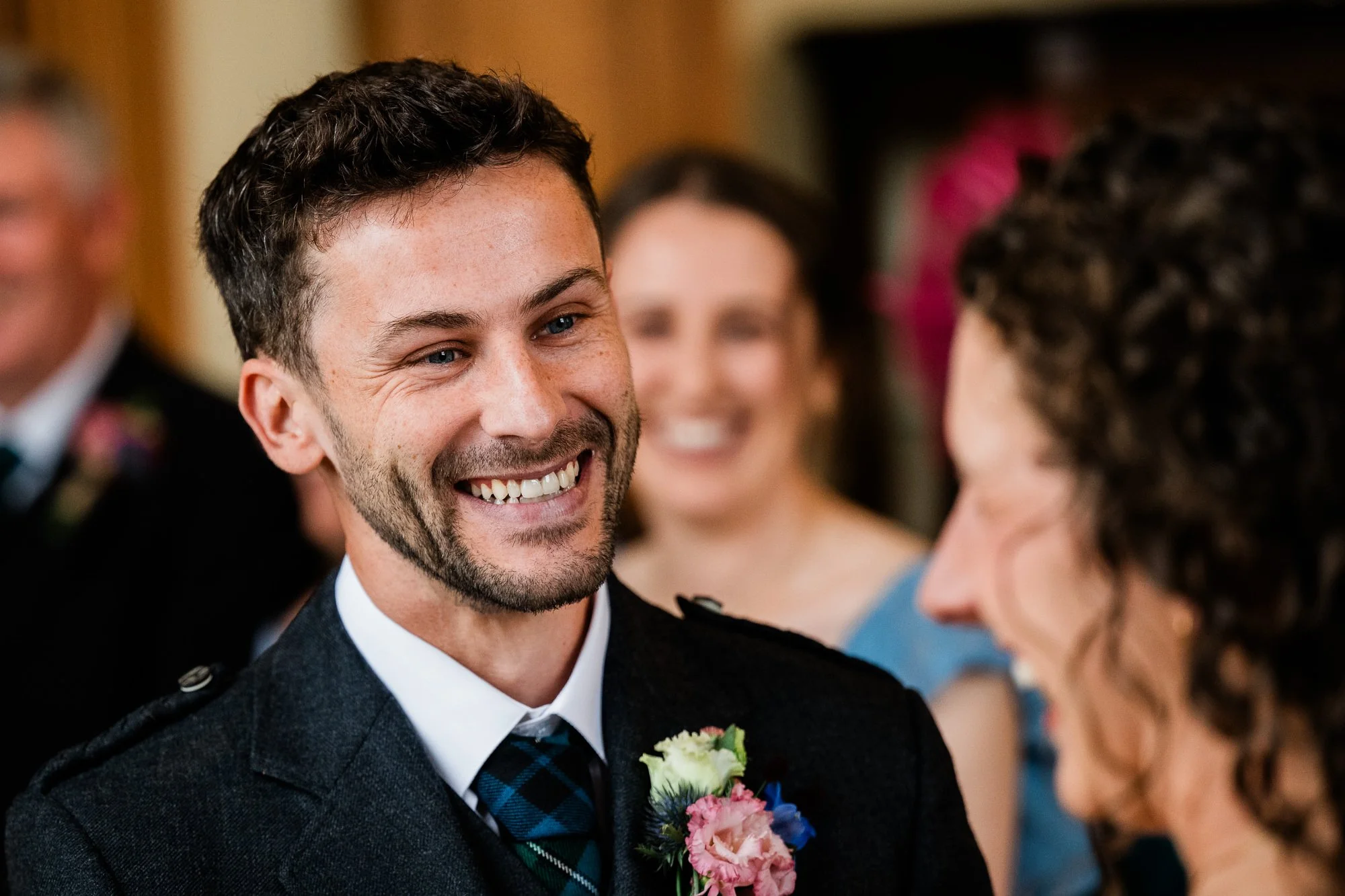Matthew smiles at Aimee during their ceremony at Kinmount House.